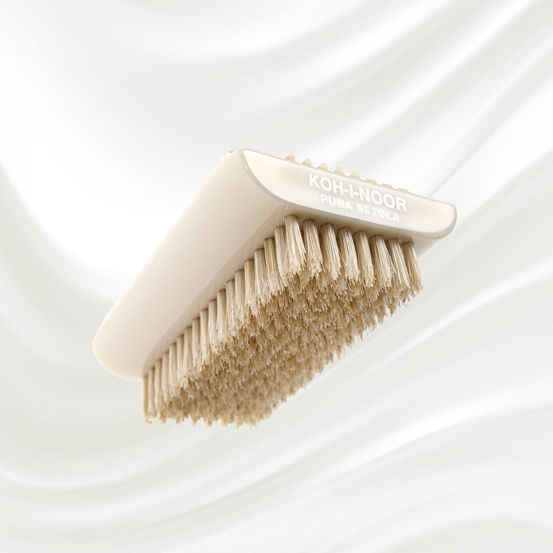 double side white nail brush with natural bristles. KOH-I-NOOR logo printed on the handle