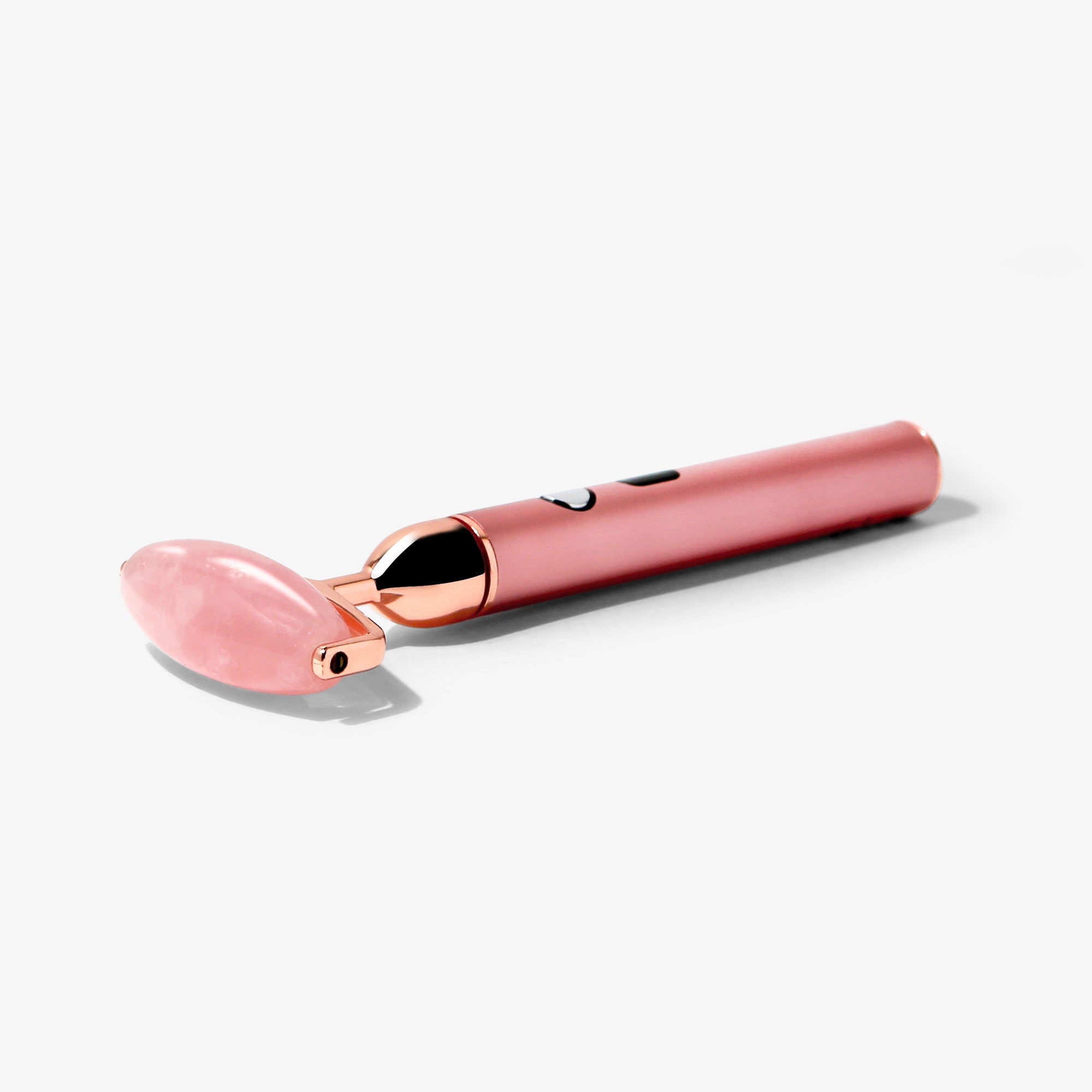 Rousa | Vibrating Rose Quartz Roller. by Vanity Planet